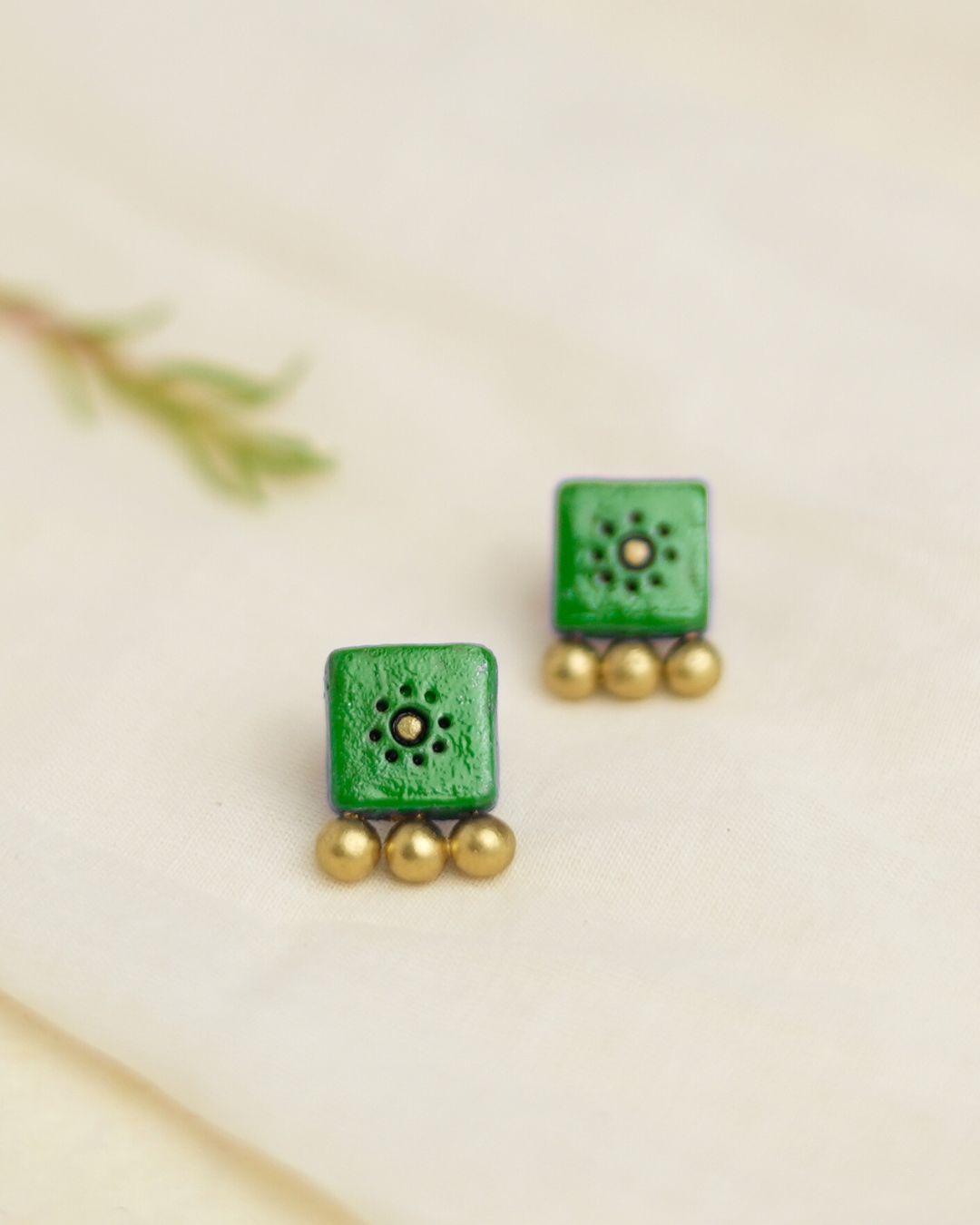 green-stud-earrings