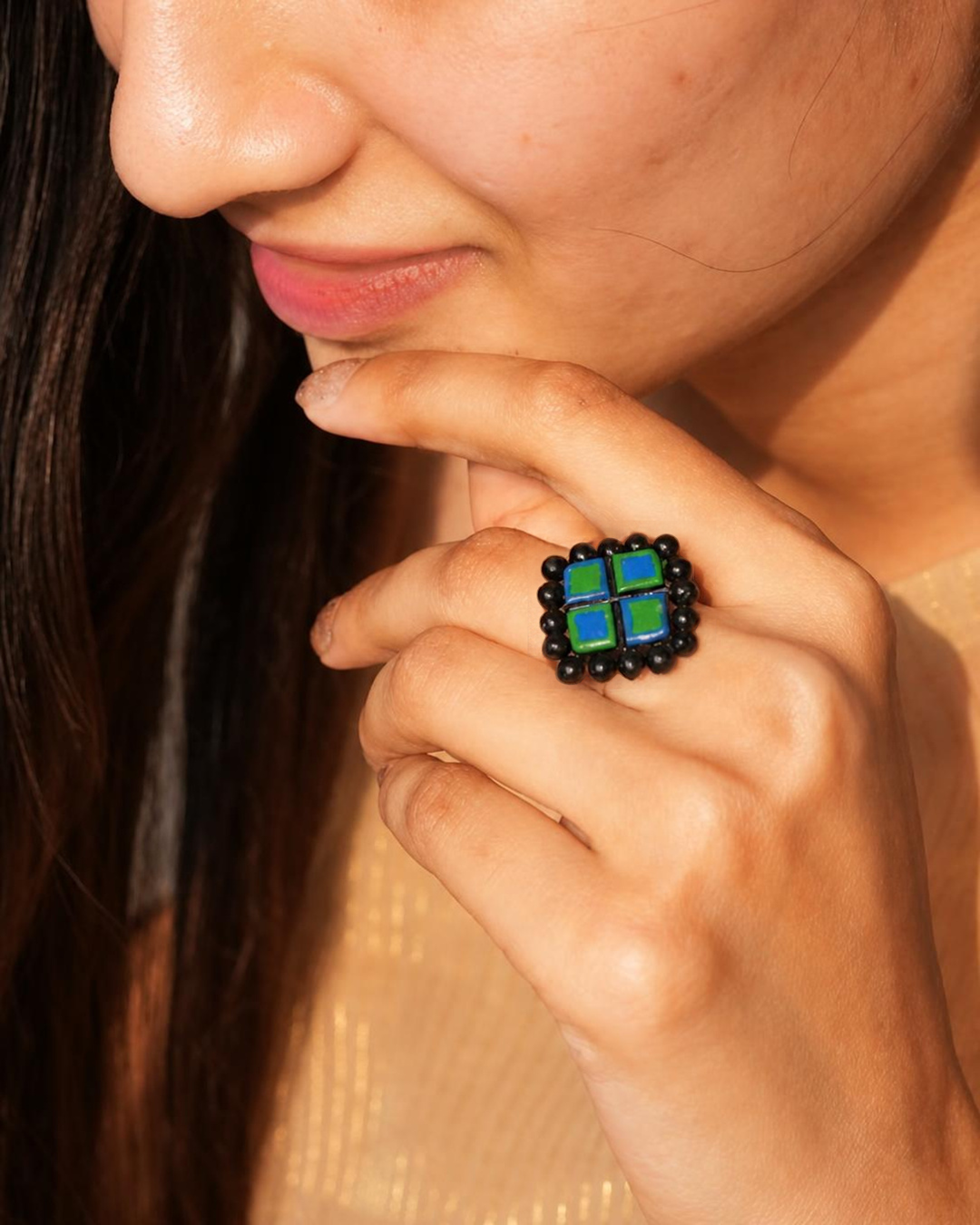 black, blue, green ring